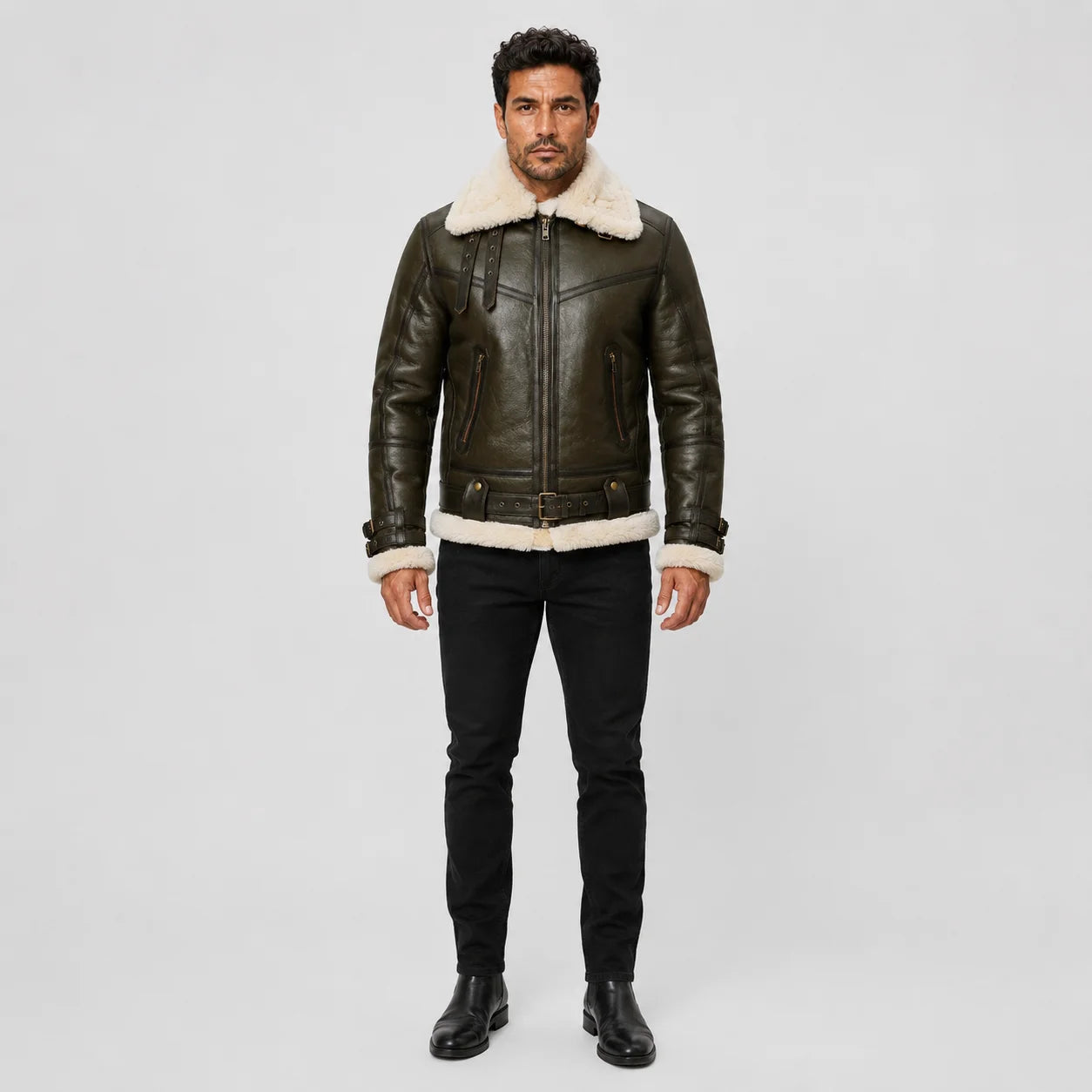 Front studio view of men’s dark olive aviator jacket with cream shearling collar, cuffs, zip pockets and buckle waist