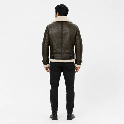 Rear studio view showing dark olive leather back panels, cream shearling collar and hem on men’s aviator jacket