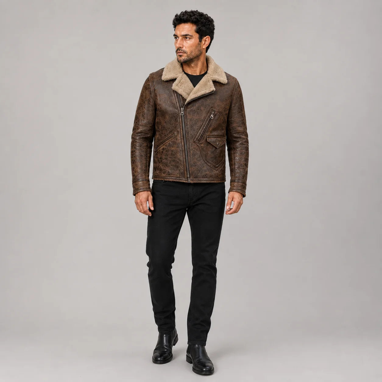 Men’s distressed brown biker jacket front view with tan plush collar, asymmetrical zip and multiple utility pockets