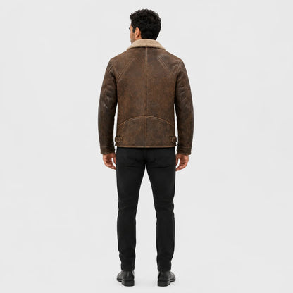 Rear model view of distressed brown biker jacket showing centre back seam, shaped lower panel and side adjustment tabs