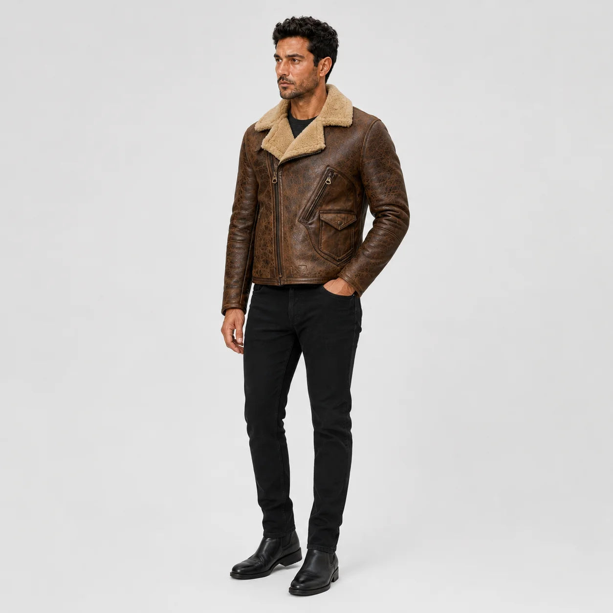 Three-quarter view of men’s vintage brown moto jacket highlighting diagonal zip, chest pocket and plush tan collar