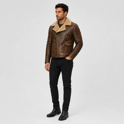 Three-quarter view of men’s vintage brown moto jacket highlighting diagonal zip, chest pocket and plush tan collar