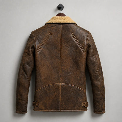 Hanging rear view of brown biker jacket showing distressed finish, curved back construction and adjustable waist tabs