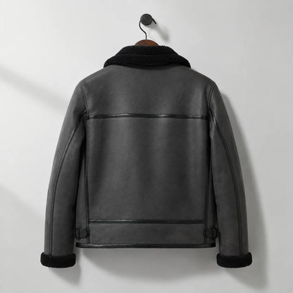 Hanging back view of men’s grey flight jacket with horizontal rear seam, panelled back and side buckle adjusters