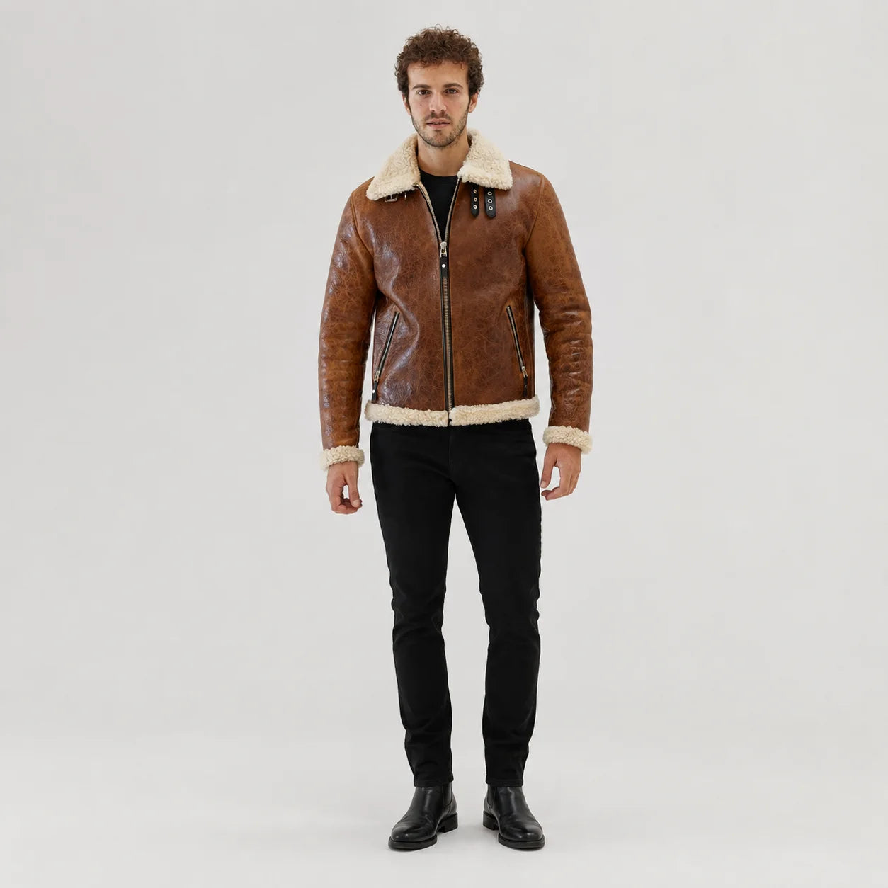 Front studio view of men’s tan aviator jacket with cream plush collar, centre zip and two angled zipped pockets