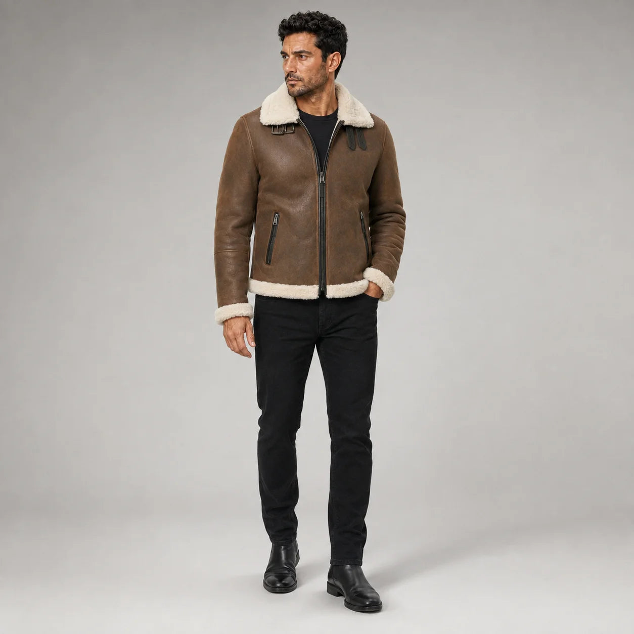 Front studio view of men’s tan brown aviator jacket with off-white plush collar, zip pockets and buckle detail