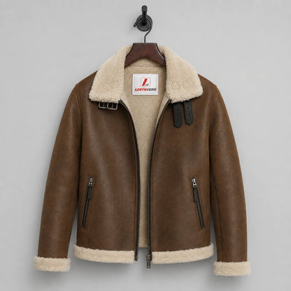 Hanging front view of tan brown flight jacket with off-white plush lining, cream trim and collar buckle straps
