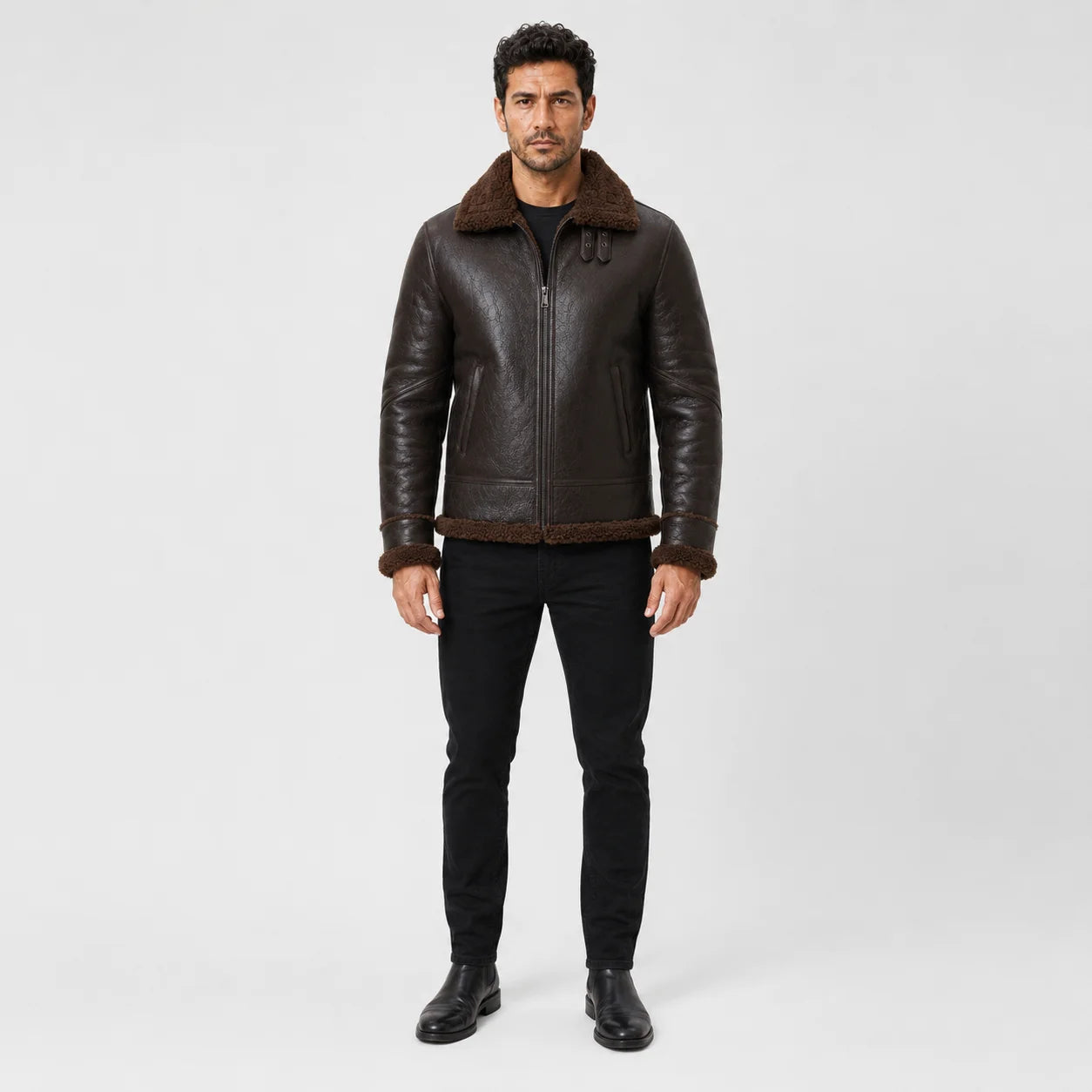 Front model view of tobacco brown aviator jacket with plush brown collar, centre zip, welt pockets and matching cuff trim