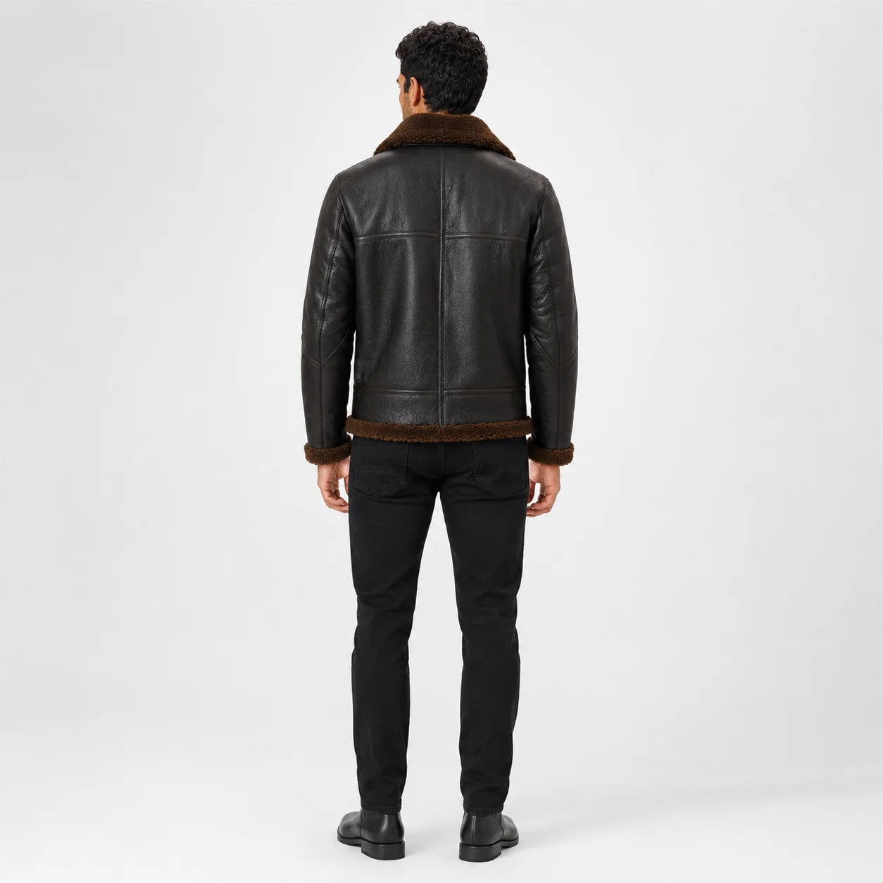 Rear model view of men’s brown aviator jacket showing plush collar, centre back seam, shoulder yoke and trimmed hem