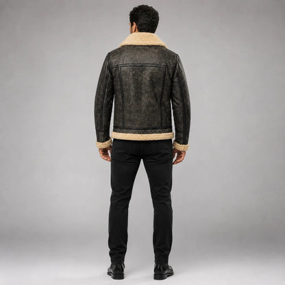 Rear studio view of waxed sheepskin jacket showing cream Sherpa collar and hem with structured back panel seams